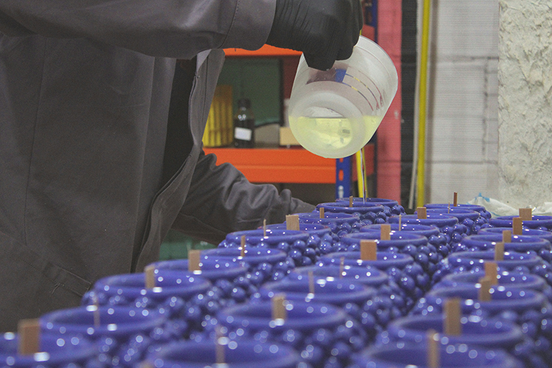 A worker pours chemicals into containers. Agent Orange, a chemical herbicide used in the Vietnam War, sparked one of the most infamous mass tort claims in US history.